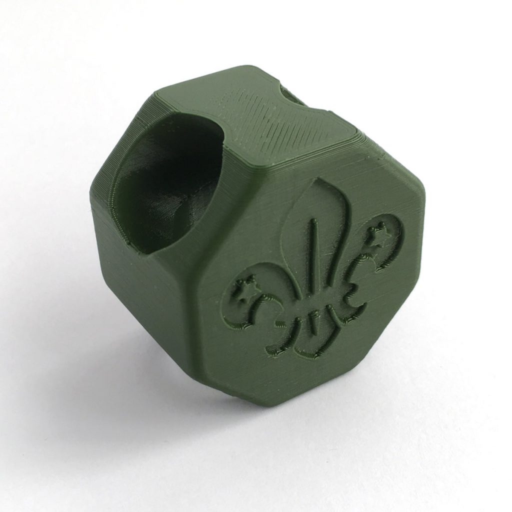Octagonal green woggle with Scouting Logo