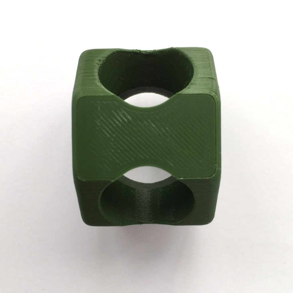 Octagonal green woggle with Scouting Logo