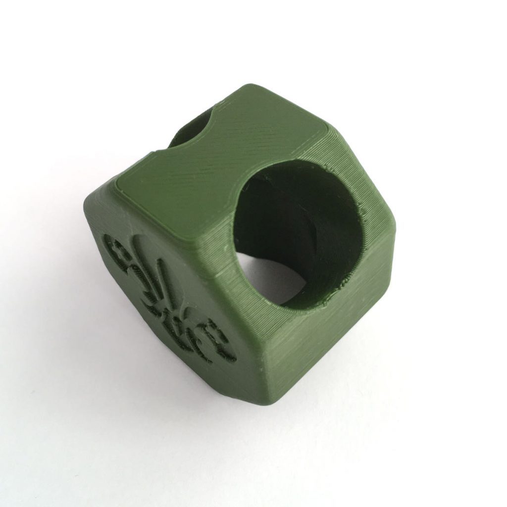 Octagonal green woggle with Scouting Logo