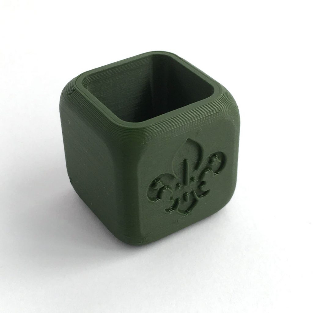 Square green woggle with Scouting Logo